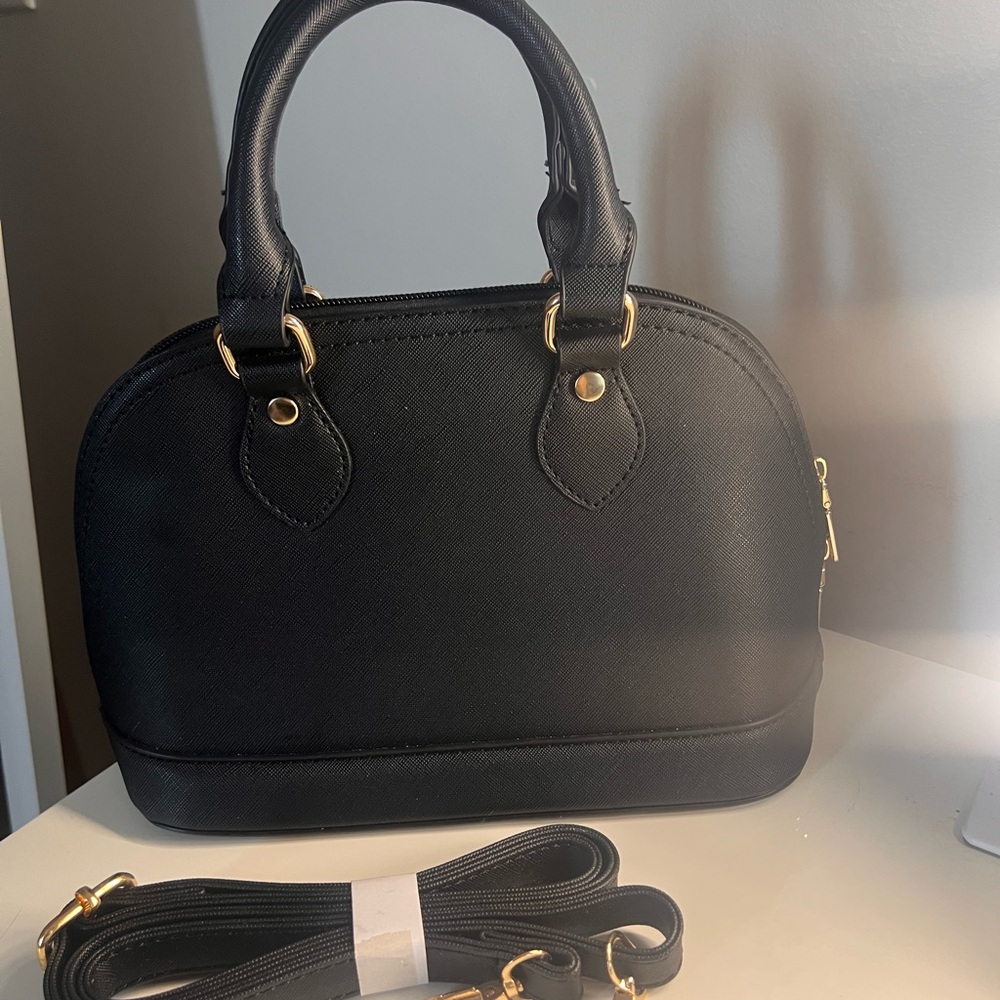 Elegant Black womens Handbag,with reversible strap.